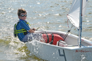 Young Sailor in an Optimist sailboat on Lake Eustis.